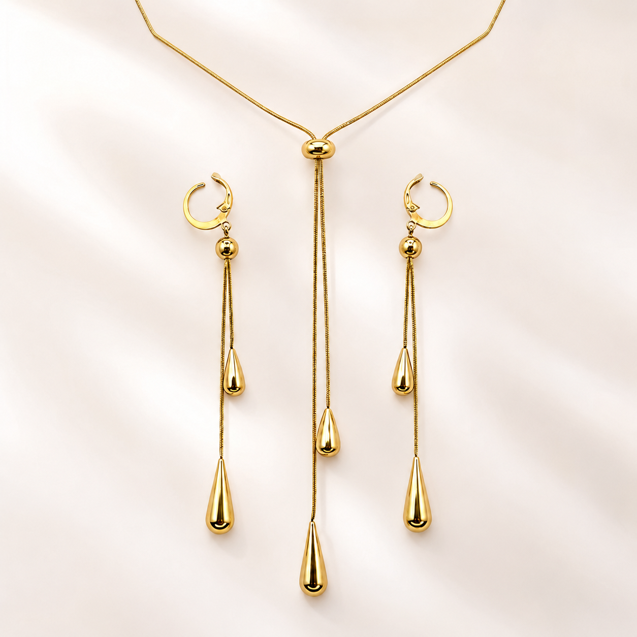 Elegant teardrop jewelry set featuring a necklace and earrings.